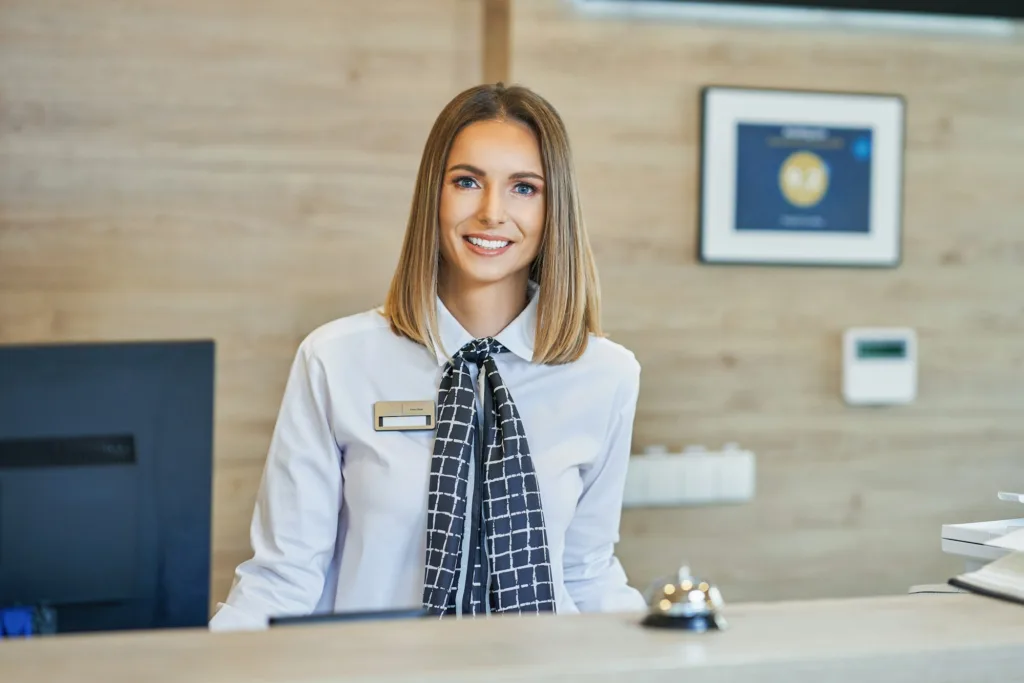Receptionist at hotel front desk