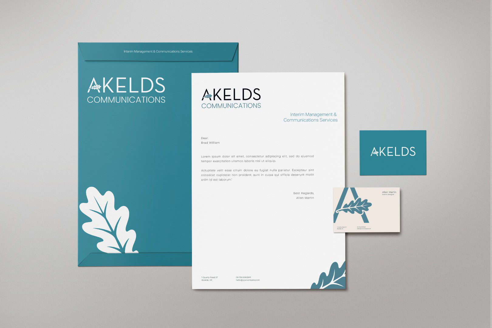 Akelds Communications stationery and business card designs in teal