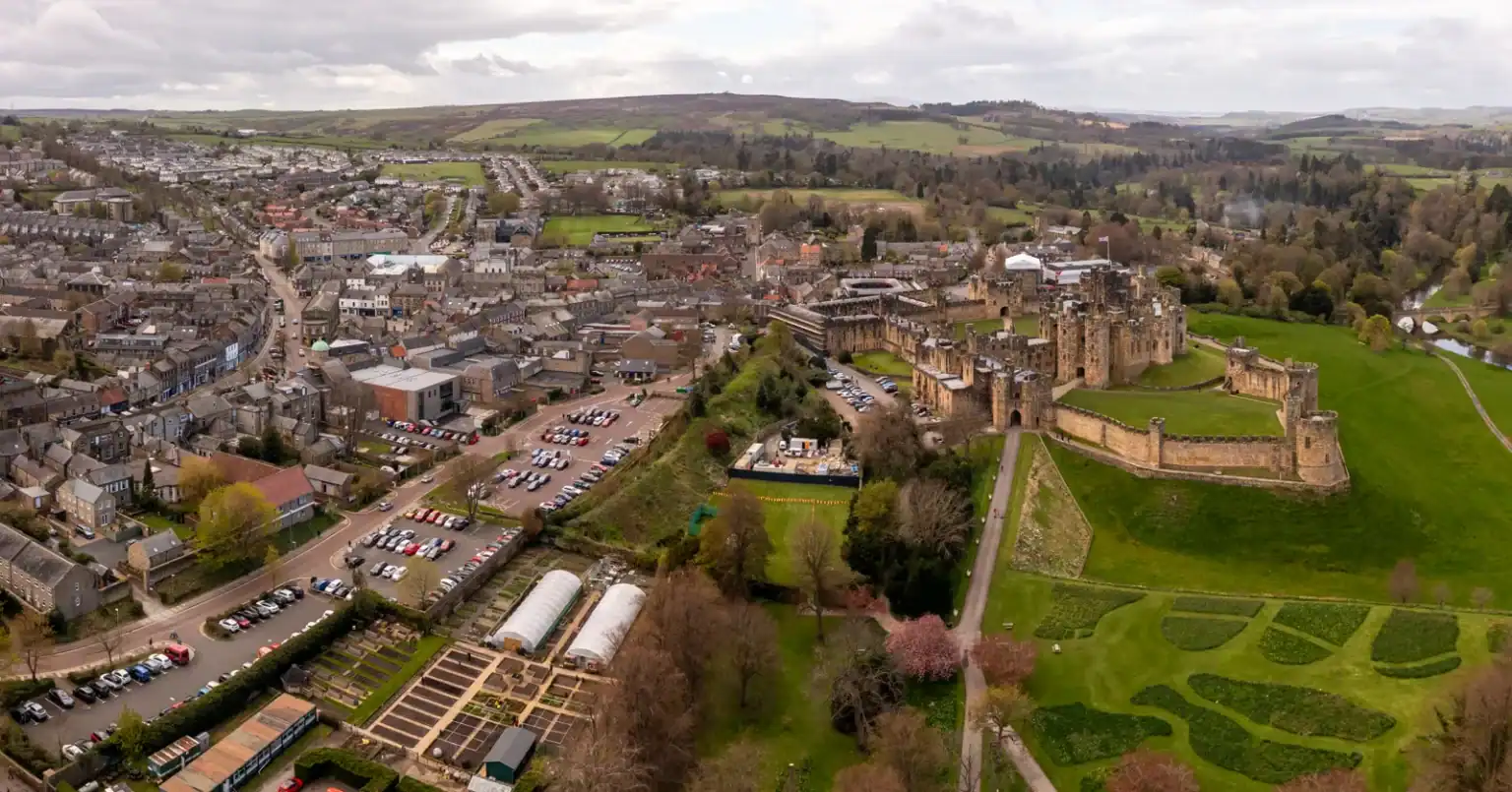 Aerial view of Alnwick town centre and Alnwick Castle, Northumberland