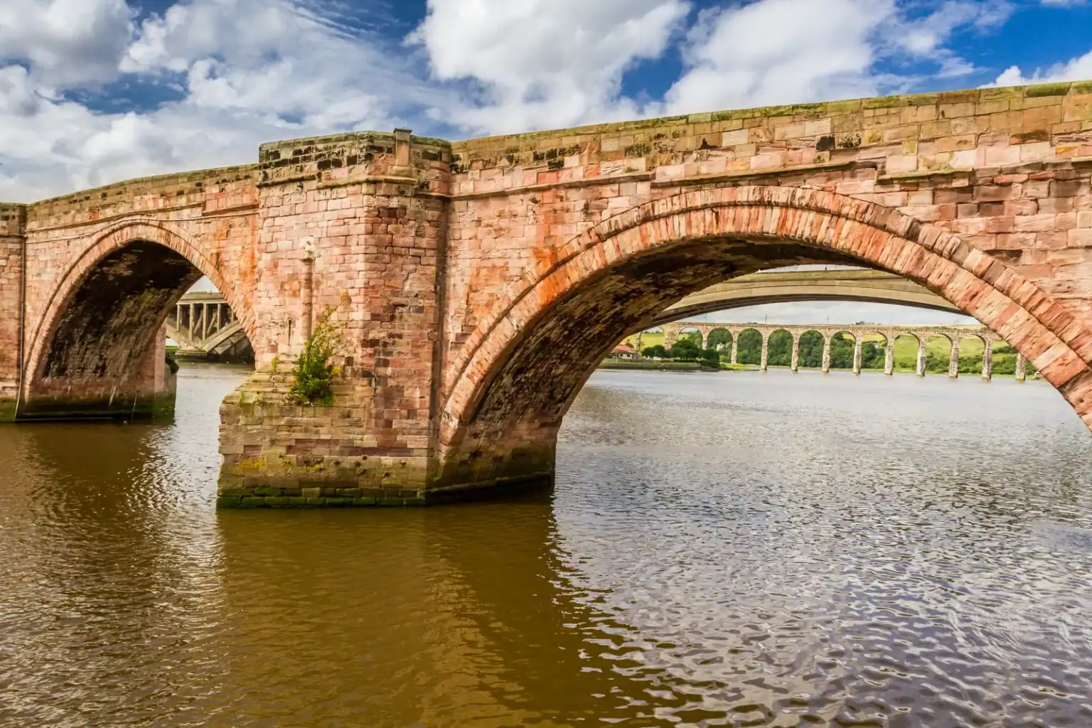 Berwick-upon-Tweed Old Bridge over the River Tweed with the Royal Border Bridge behind