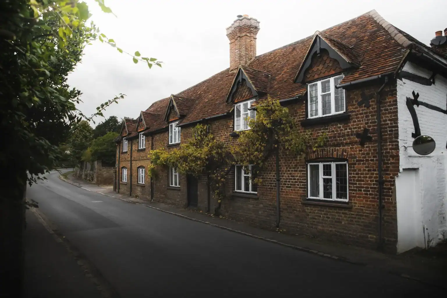 Brick-built country pub on a quiet village road